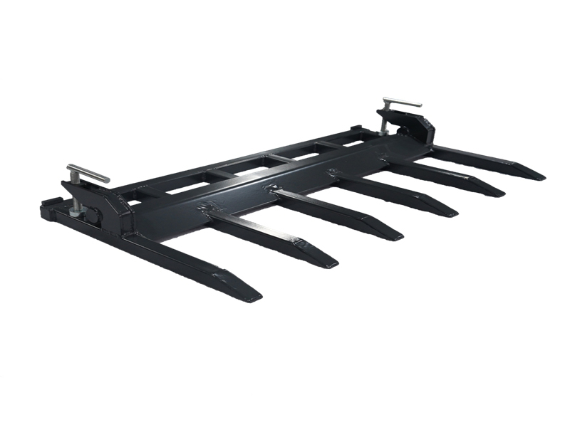 De bijlage van de tractorvorken voor emmer - je geheime wapen voor moeiteloos puin opruimen